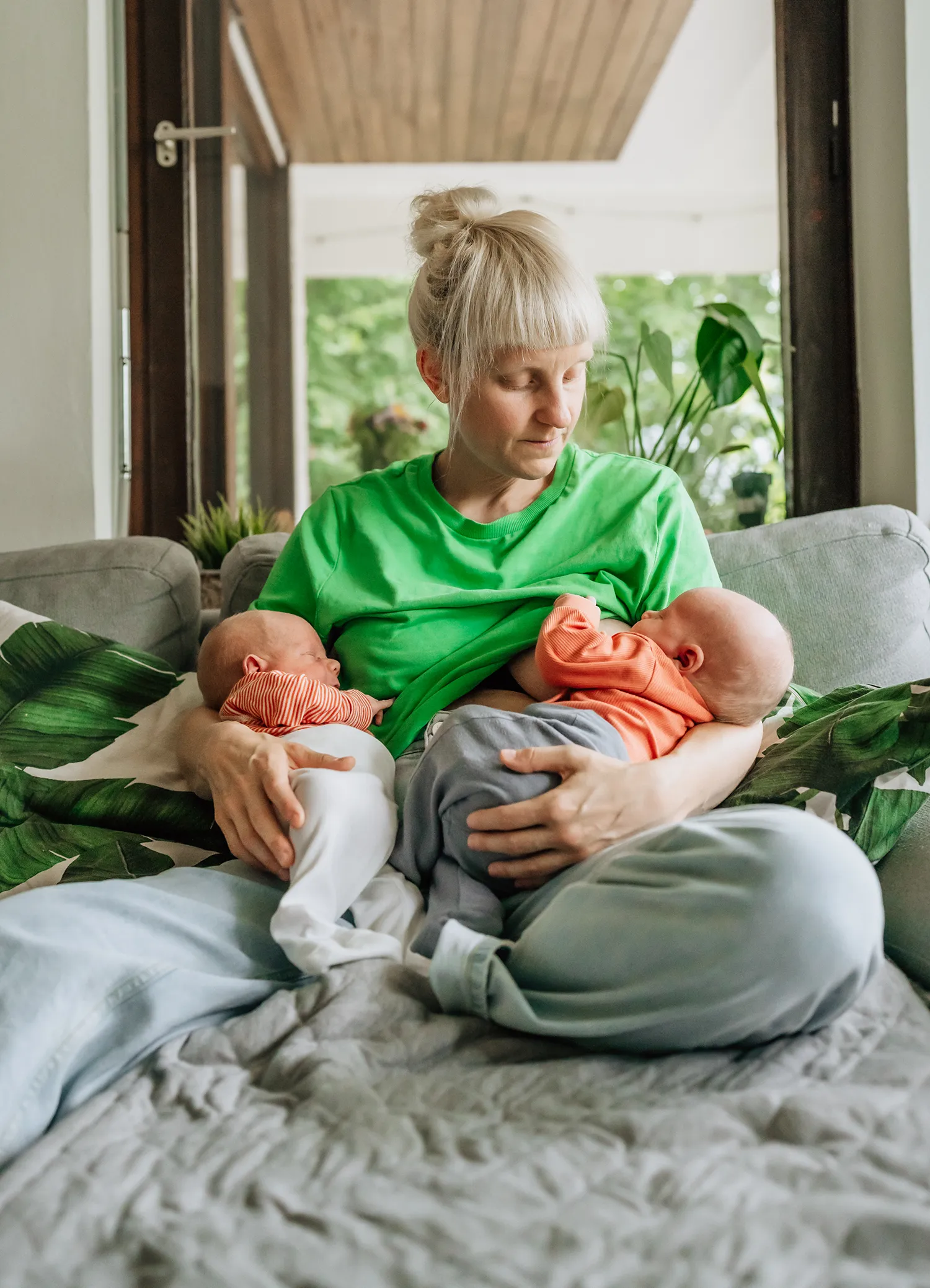 Documentary newborn family photography twins breast feeding